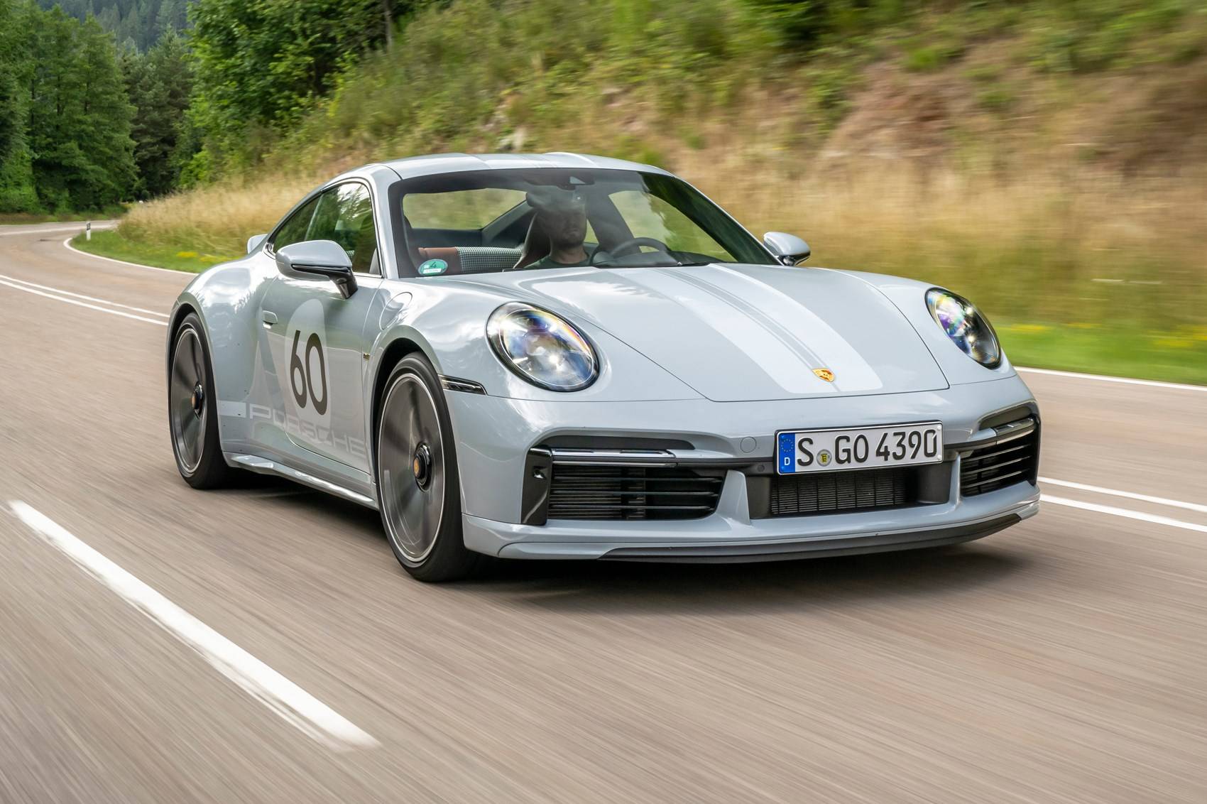 The Porsche 911 Sport Classic in a blue grey on an open road.