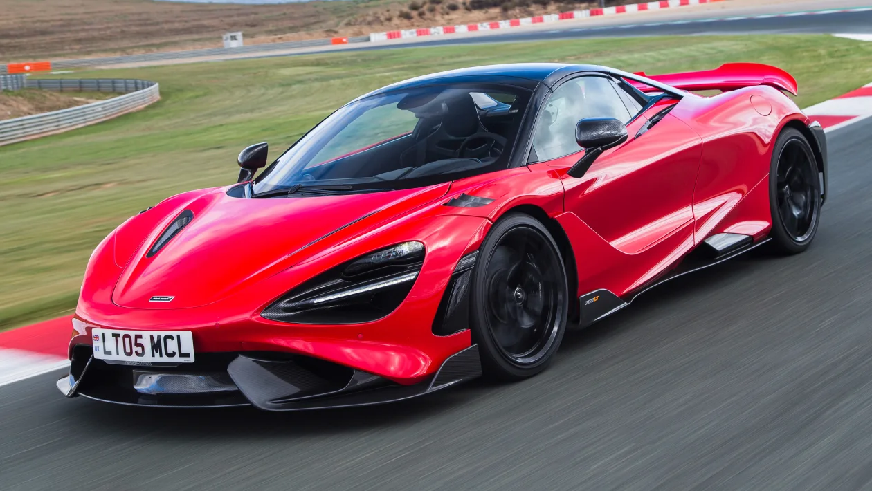 The McLaren 765LT Spider in red on a race track.