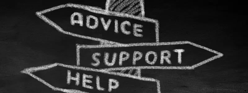 A chalkboard drawing of a signpost showing 'ADVICE', 'SUPPORT' and 'HELP' with arrows pointing in different directions.