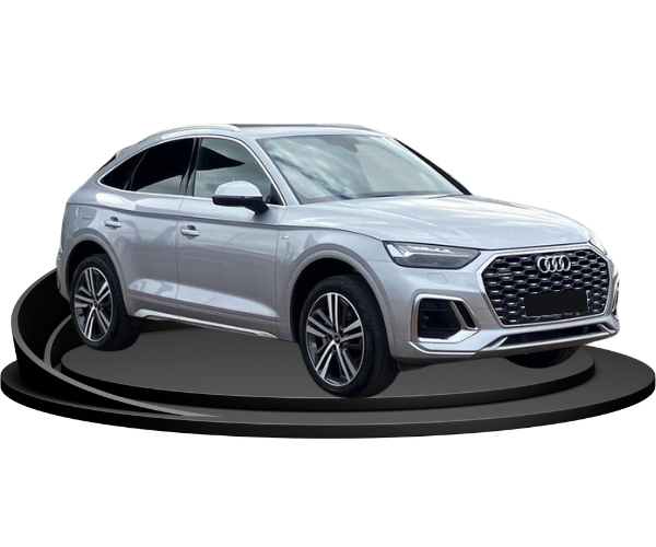 A grey Audi Q5 side on, sat on a curved podium, against an empty background.