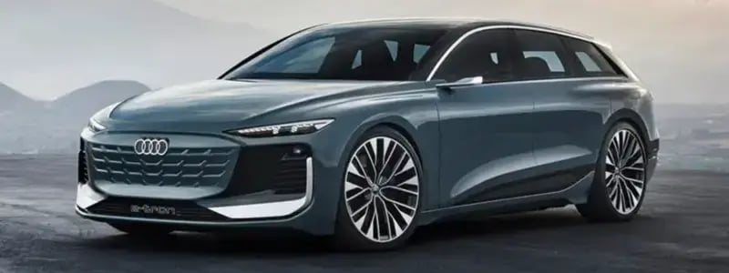 An Audi A6 E-Tron against a hilly background.