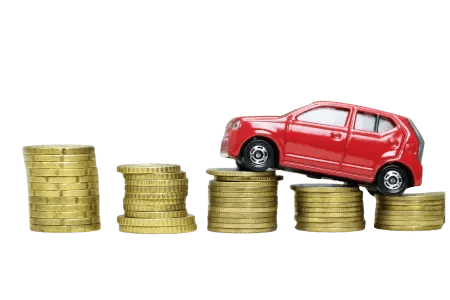 A toy car on top of a stack of coins, representing finances and cars.