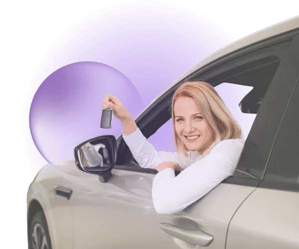 A woman holding car keys and smiling from inside a car, with a purple glow and purple translucent bubble behind her.