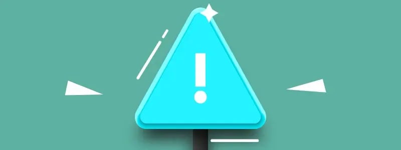 A blue caution sign against a green background.