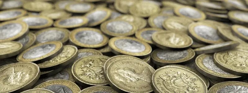 A close up of a piles of pound coins.