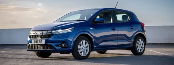 A blue Dacia Sandero parked outdoors.