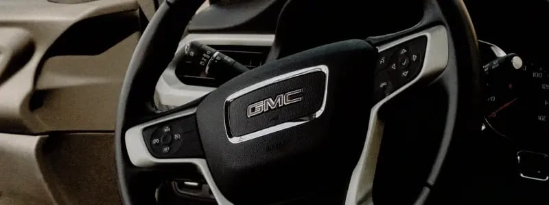 A close up of a GMC steering wheel.