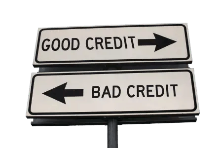 Two signs pointing in different directions. One with good credit and one with bad credit on, both pointing in different directions.