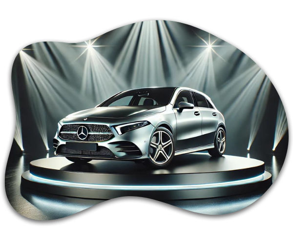 Silver Mercedes-Benz showcased on a rotating platform under dramatic spotlighting, highlighting its sleek and luxury design.