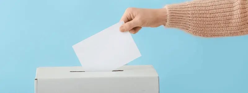 A person placing a vote inside a ballot box, against a sky blue background.