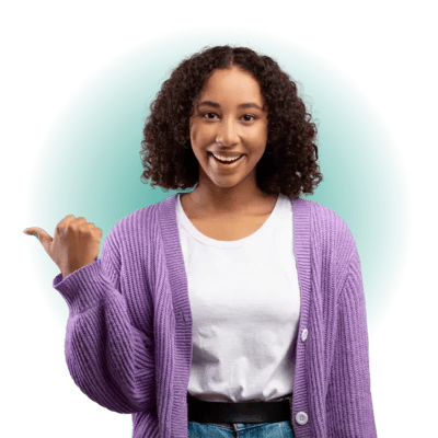 A person pointing to the side whilst smiling.