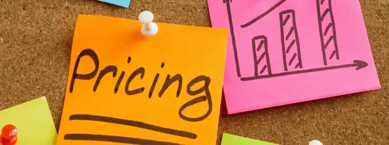 A post-it-note with 'Pricing' on, with another note with a graph on, joined by other post-it-notes, symbolising a strategy.