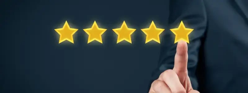 A person tapping a star, as part of a collection of five stars, representing a positive review.