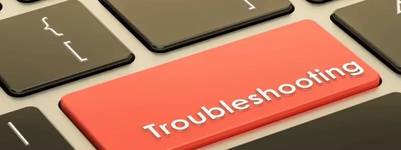 A close up of a laptop button reading 'Troubleshooting'.