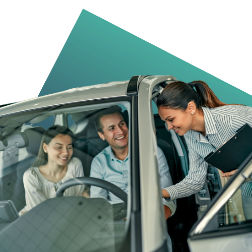 A couple speaking to a car dealer with a teal geometric shape in the background.