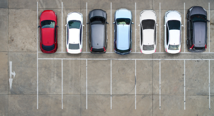 An areal shot of cars in a car park