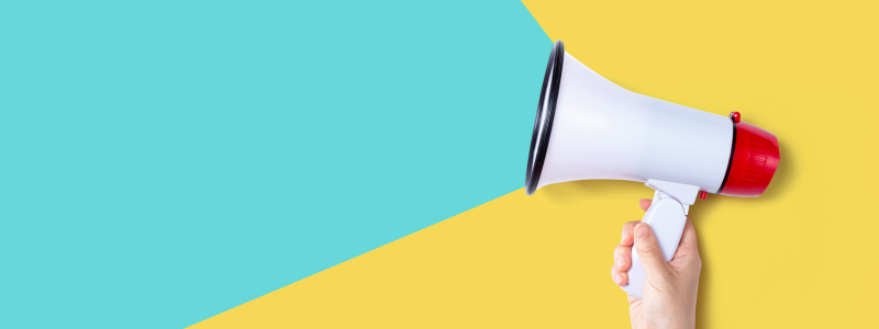 A megaphone on a teal and yellow background.