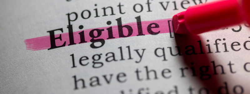 A close up of a piece of text where the word eligible is highlighted in pink.
