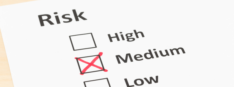 A document with "Risk" at the top and checkboxes labeled "High," "Medium," and "Low," with "Medium" checked off.